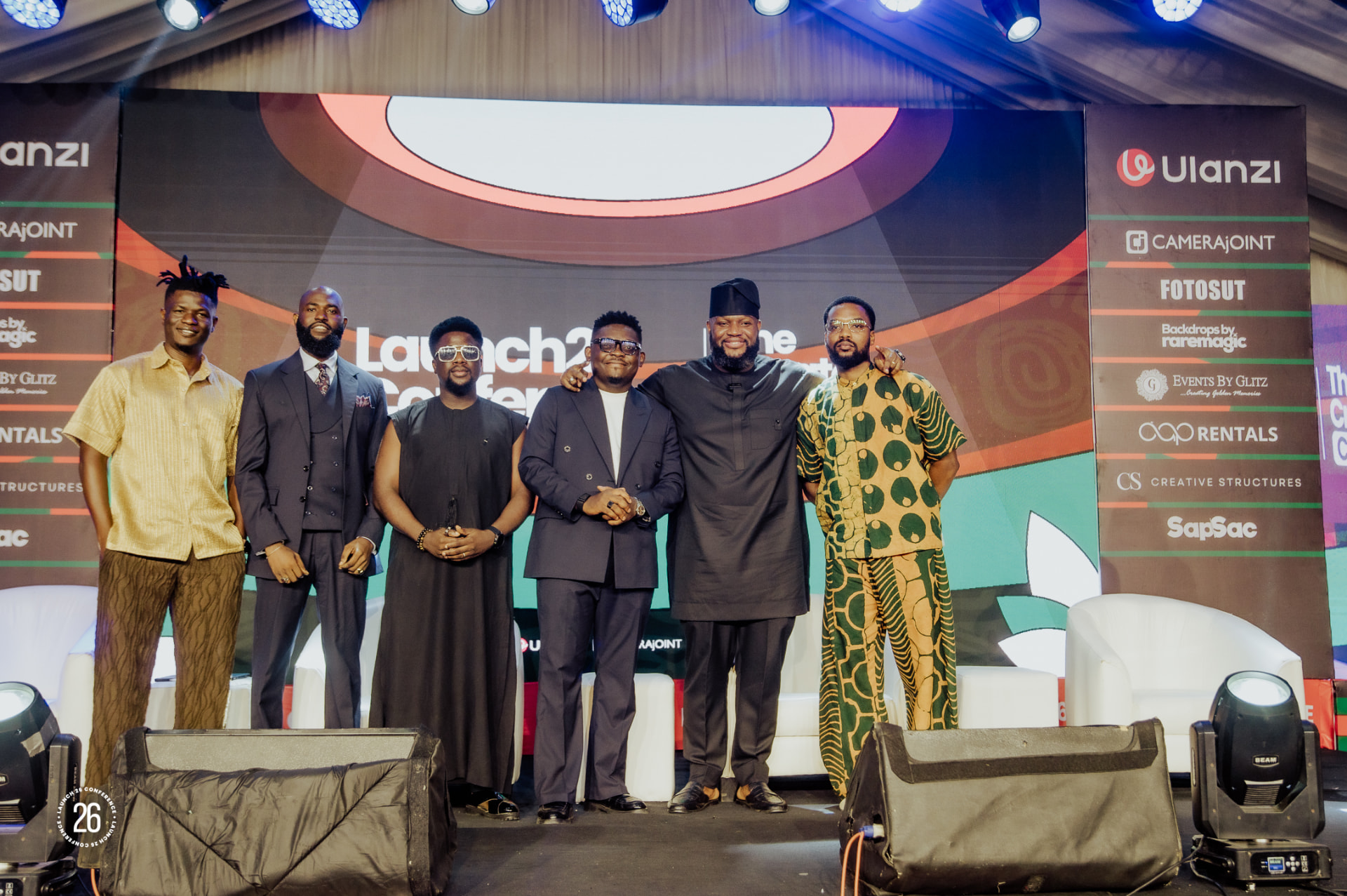 Creators posing on stage at the Launch26 Conference